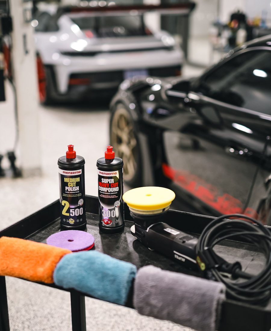 Compound, pads and a polisher on a detailing cart